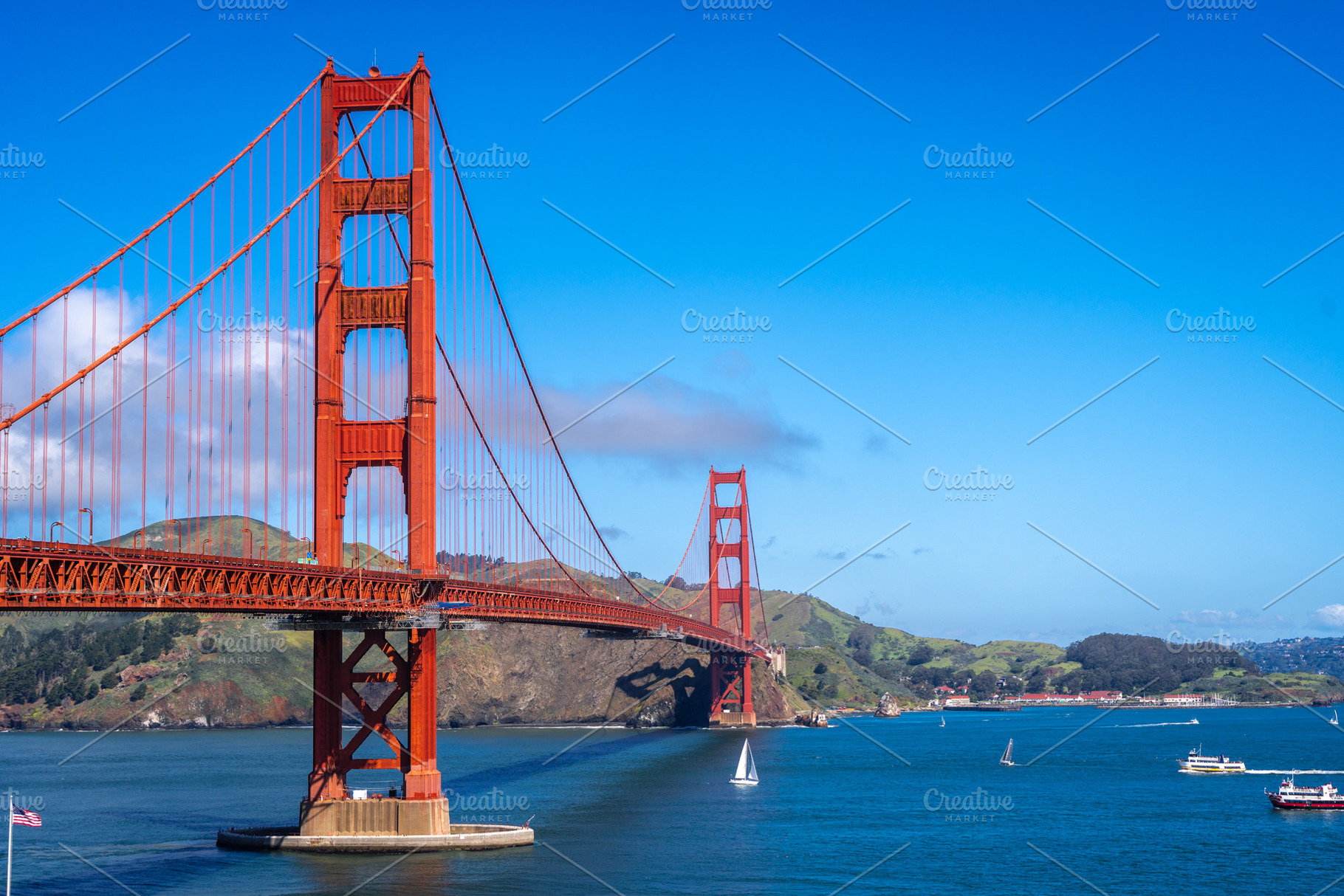 Golden Gate Bridge over blue waters with scenic hills in San Fra, an Architecture Photo by GoodGoods
