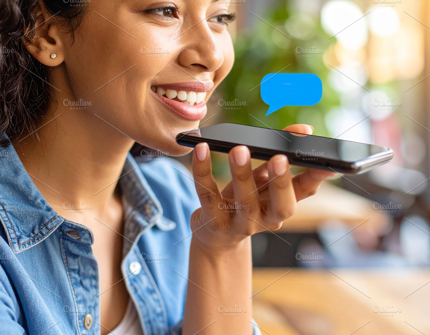 Person engages with an AI assistant on their smartphone at coffe, a Technology Photo by DanFLCreativo