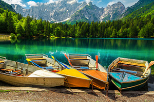 Colorful tourist rowing boats, a Transportation Photo by Alpine Dreams