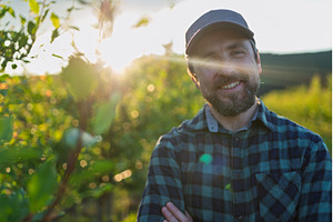 A mature farmer standing in the, a Person Photo by HalfPoint