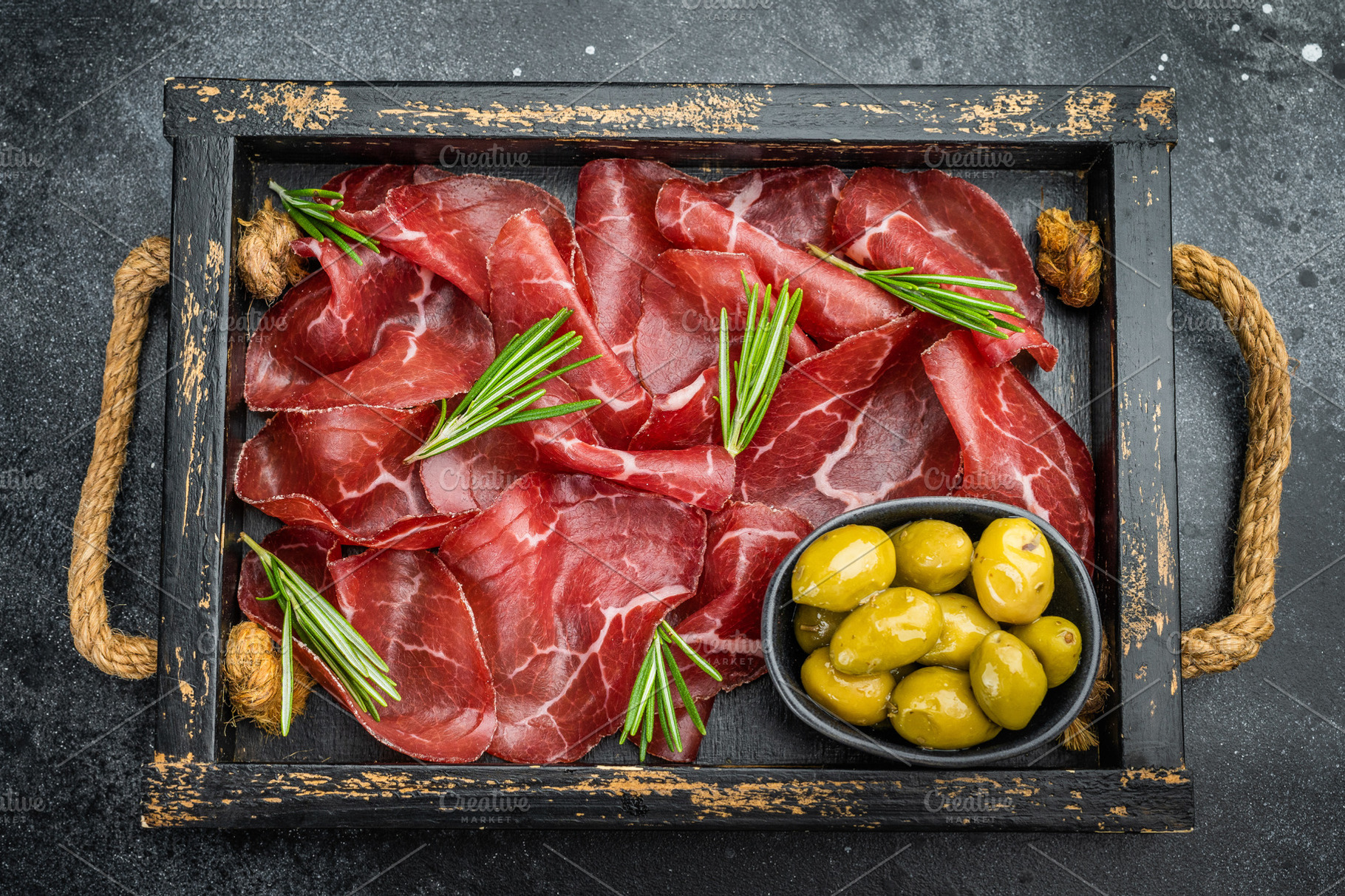 Italian bresaola with rosemary and green olives served in a vint, a Food & Drink Photo by composter-box@mail.ru