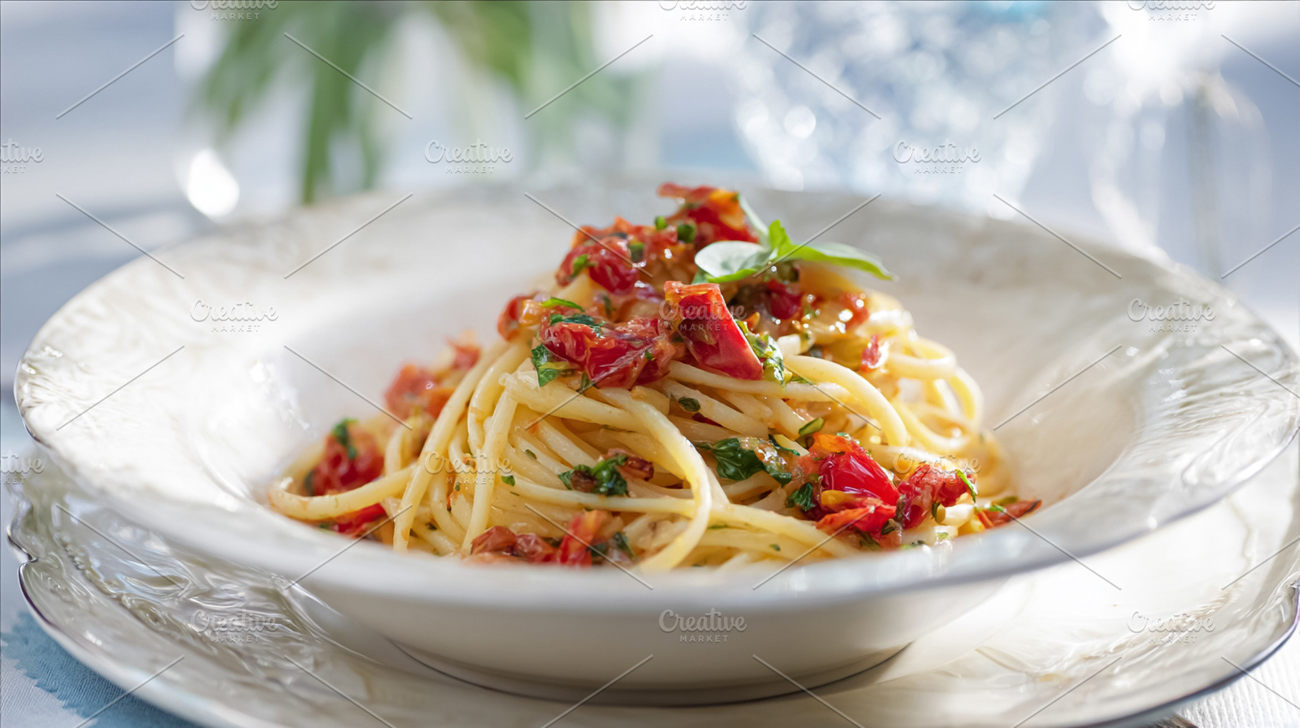 Spaghetti pasta with fresh tomato sauce and basil leaves, presen, a Photo by Studio ANNA