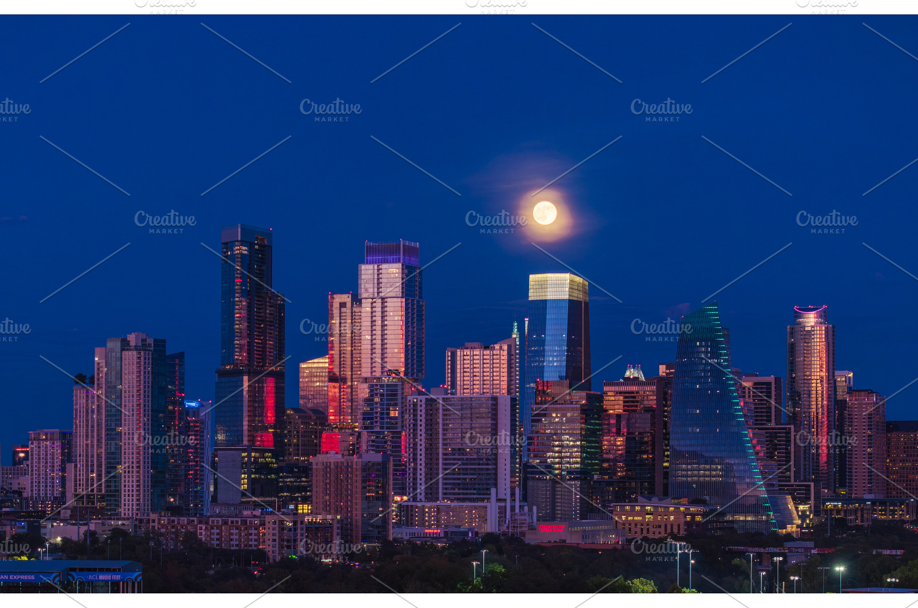 Harvest moon in the Austin skyline, an Architecture Photo by Backyard Stock