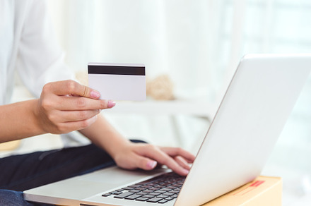 Woman hands holding credit card for online shopping or ordering, a Business Photo by Ministocker