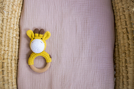 in a basket natural wooden knitted toys for a newborn. View from