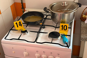 Kitchen crime scene investigation with numbered evidence markers