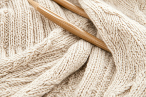 Knitting needles with yarn creating, a Photo by Dvoevnore photos