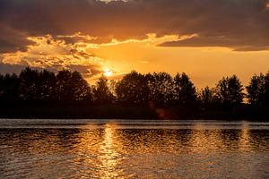 the lake with silhouetted trees, sunset on the lake shore with trees, landscape, a Photo by rsoollAI