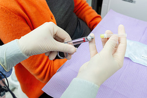 Doctor preparing injection with carpule syringe for local anesthesia, a Health & Medical Photo by Antonio Gravante Market