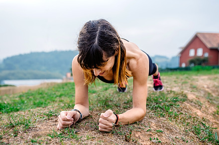 Female athlete training doing plank, a Sports & Recreation Photo by davidpereiras