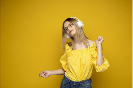 Happy girl in a glasses and yellow, a Person Photo by volodymyrshtun13795