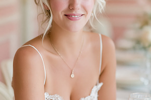 Elegant blonde woman smiling at a formal dinner, celebrating spe, a Person Photo by Studio ANNA