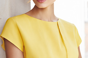Elegant blonde woman posing in yellow dress with blue eyes and g, a Beauty & Fashion Photo by Studio ANNA