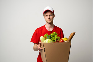 Deliver man wearing red uniform, a Person Photo by volodymyrshtun13795
