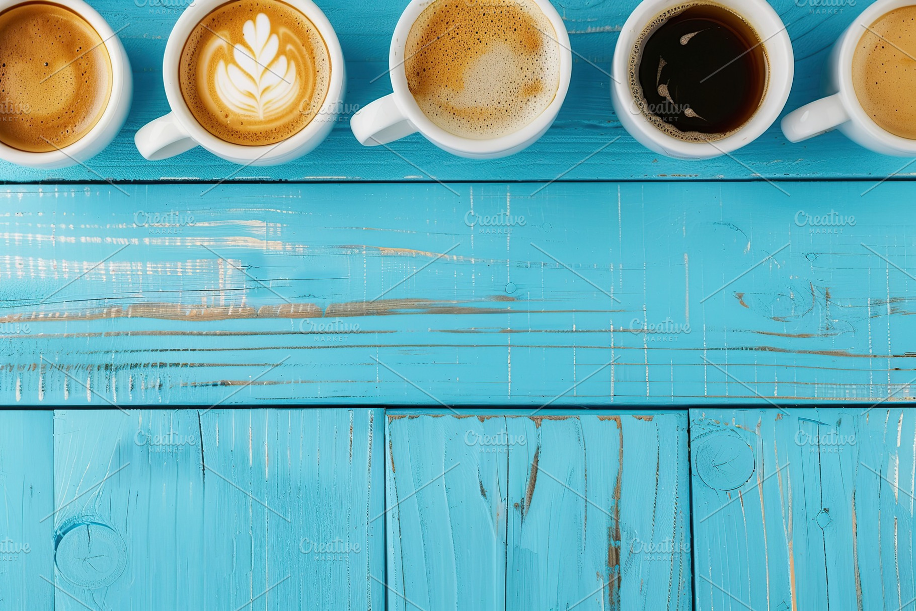 Flat lay of different cups of coffee with copyspace on wooden table, a Food & Drink Photo by AlyaAnd