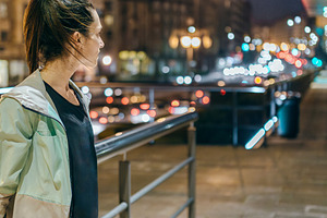 Woman wearing sportswear looking to empty sidewalk at night in t, a Sports & Recreation Photo by davidpereiras