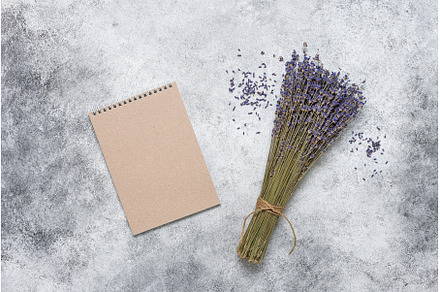 Blank brown notepad and dried