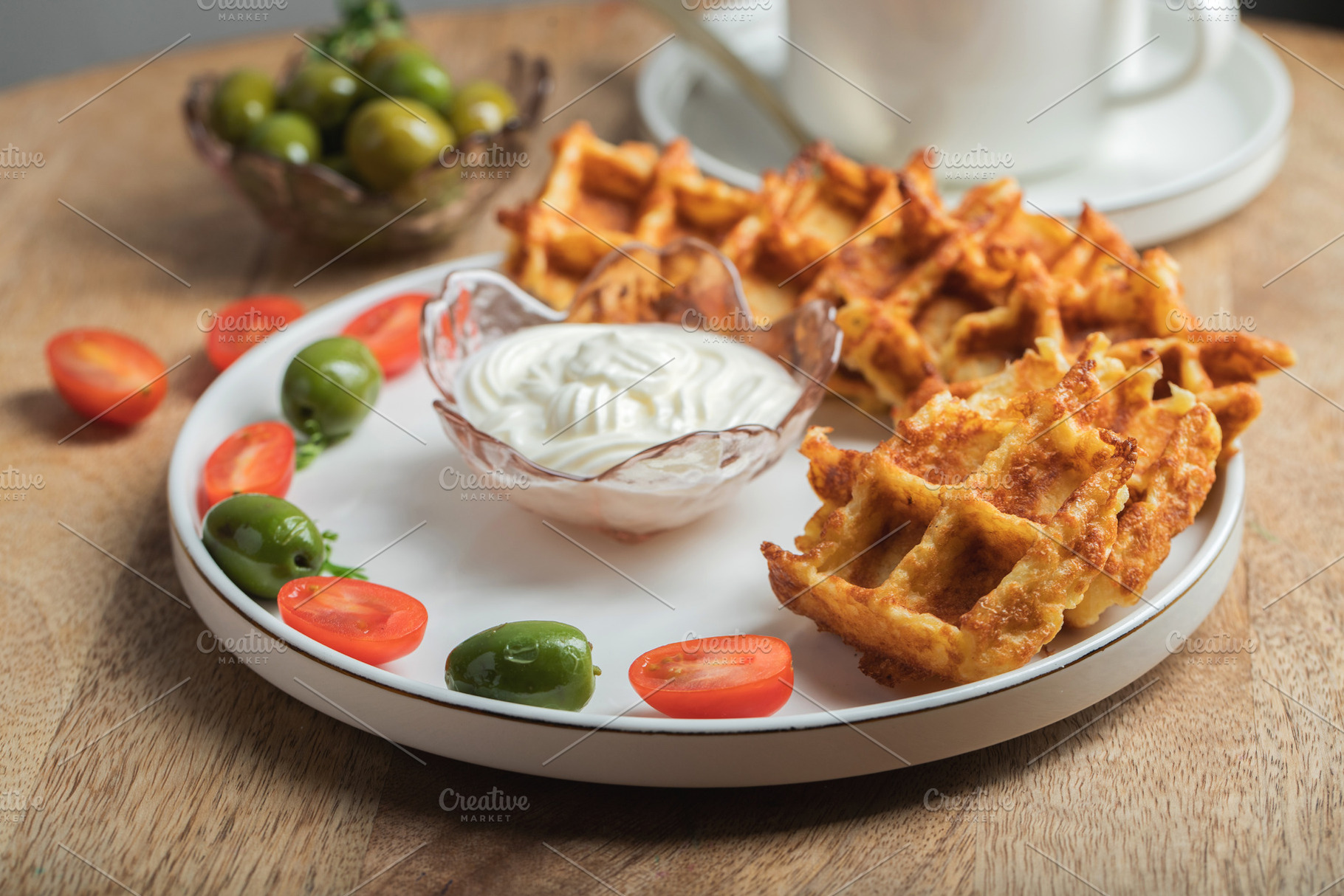 Top view of Homemade Potato Waffles, ricotta cheese and mayonese sauce. Served, a Food & Drink Photo by Budarinphoto