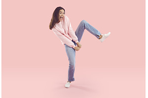 Cheerful young woman dancing