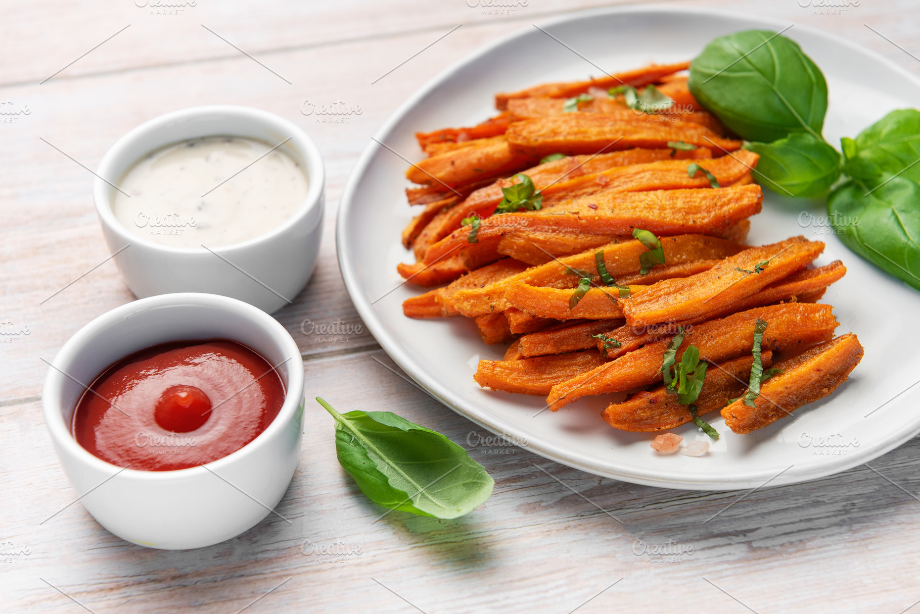 Sweet potato fries with ketchup and ranch sauces, a Food & Drink Photo by Olena Rudo
