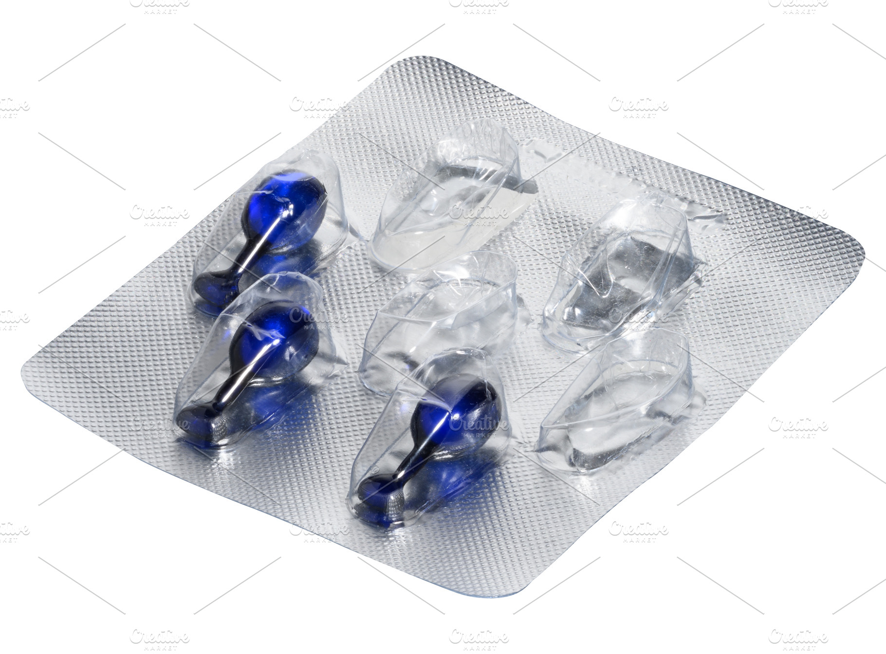 Blister pack with blue cosmetic or medicinal capsules on an isol, a Health & Medical Photo by ndanko