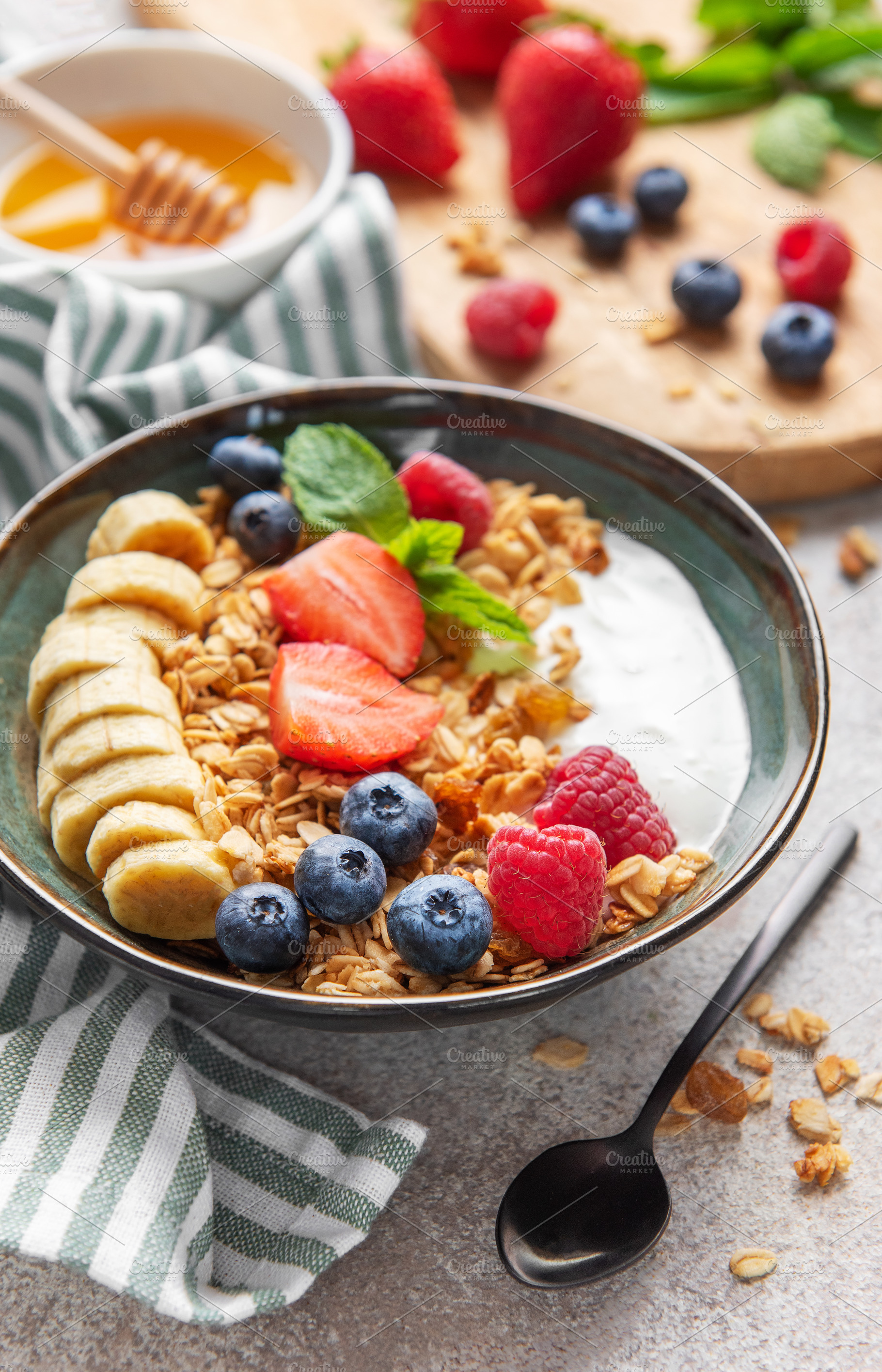 Delicious granola with yogurt, fresh berries and banana slices e, a Food & Drink Photo by Olena Rudo