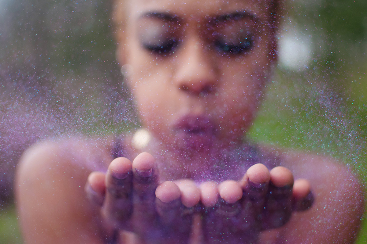 A woman blowing glitter, a Person Photo by Chelsea Victoria (Photo 1 of 2)