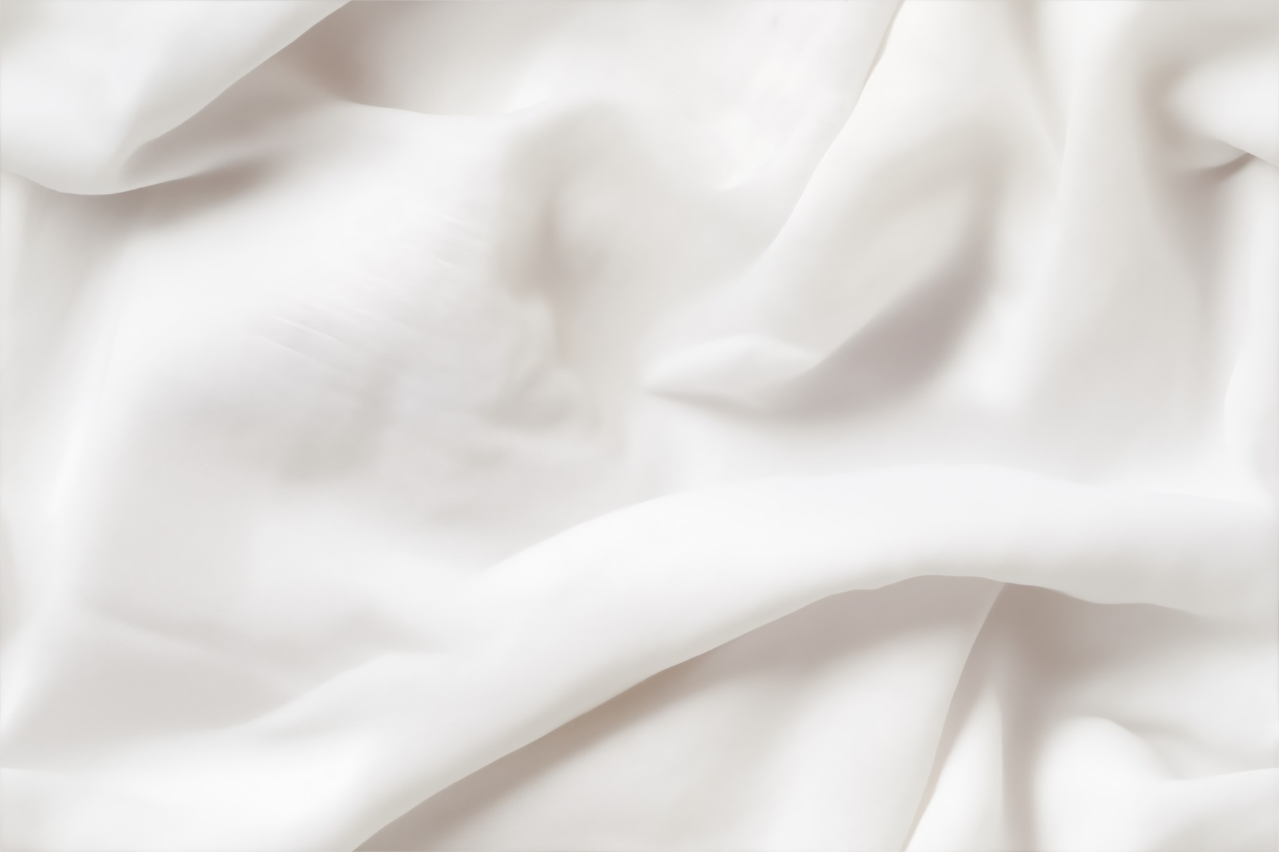 Smooth, flowing white cotton batiste fabric with soft folds and creases ...
