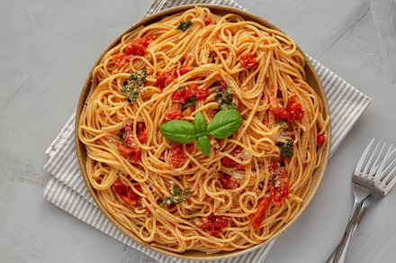 Homemade Spaghetti With Fresh Tomato Sauce on a Plate, top view., a Food & Drink Photo by LiudmylaChuhunova