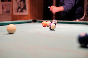 Playing billiard containing pool, table, and billiard