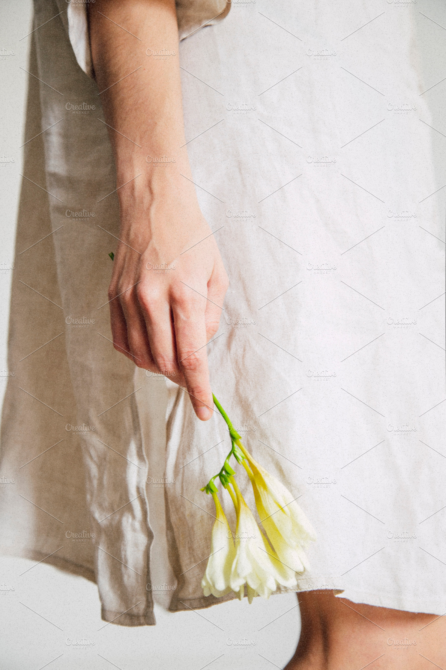 A girl with a flower containing summer, linen, and breeze, a Beauty & Fashion Photo by Mukuko Studio