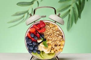 Alarm clock with a bowl instead of a clock face. The bowl is fil, a Food & Drink Photo by ndanko