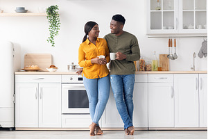 Cherful Young Black Couple Drinking, a Person Photo by Prostock-Studio