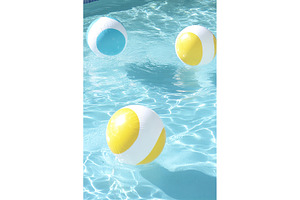 Colorful beach balls floating in a, a Sports & Recreation Photo by Lermont51