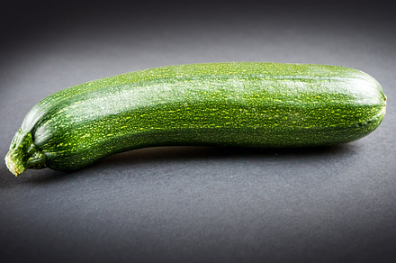 Zucchini isolated on a black background, a Food & Drink Photo by GoodGoods