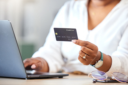 Finance, fintech woman and online shopping with credit card, laptop and internet bank app. Digital, ecommerce and online payment with business woman purchase product on store website., a Photo by Peopleimages.com
