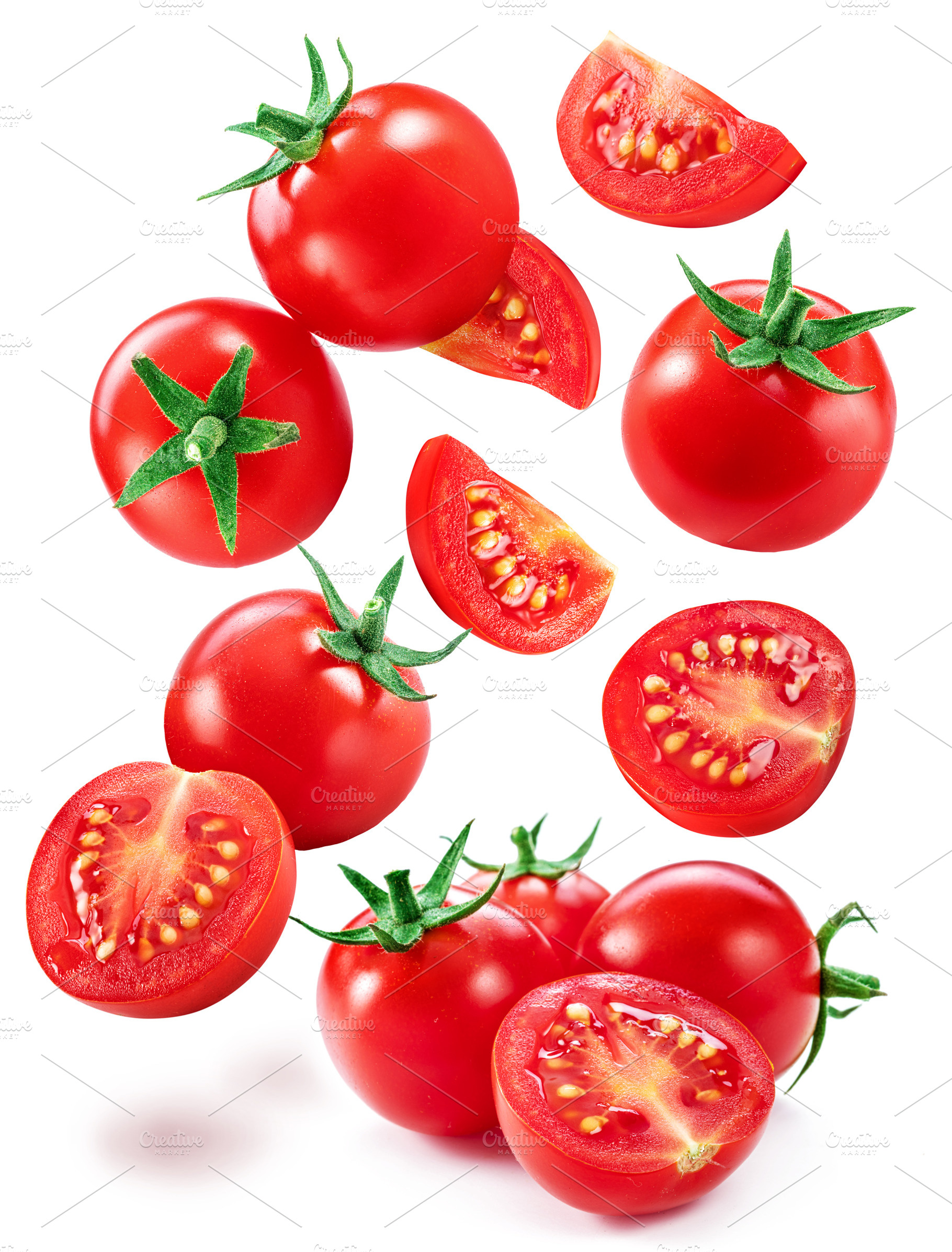 Falling cherry tomatoes and tomato slices isolated on white back, a Food & Drink Photo by Volff