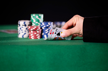 Close-up of hands with pair of kings