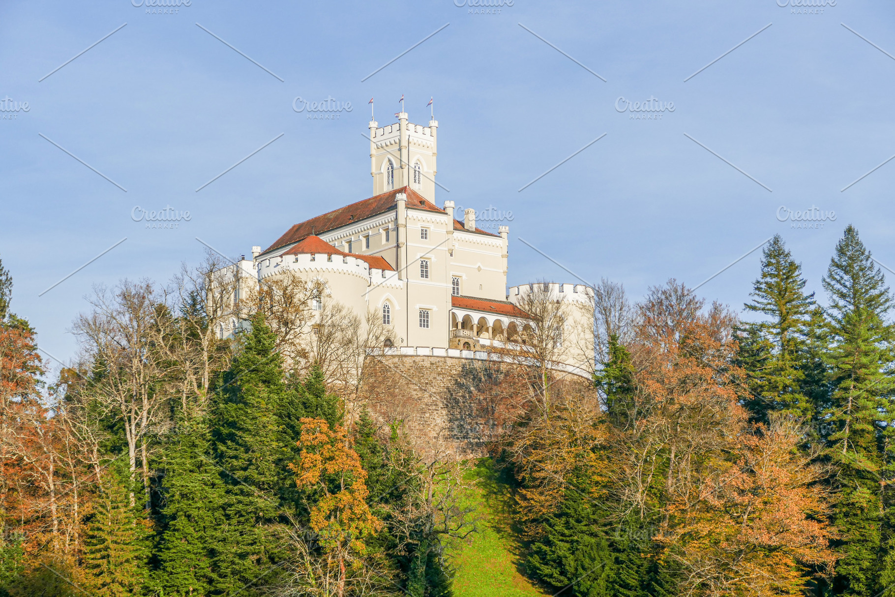 A majestic, cream-colored castle, a Photo by Pozitivo