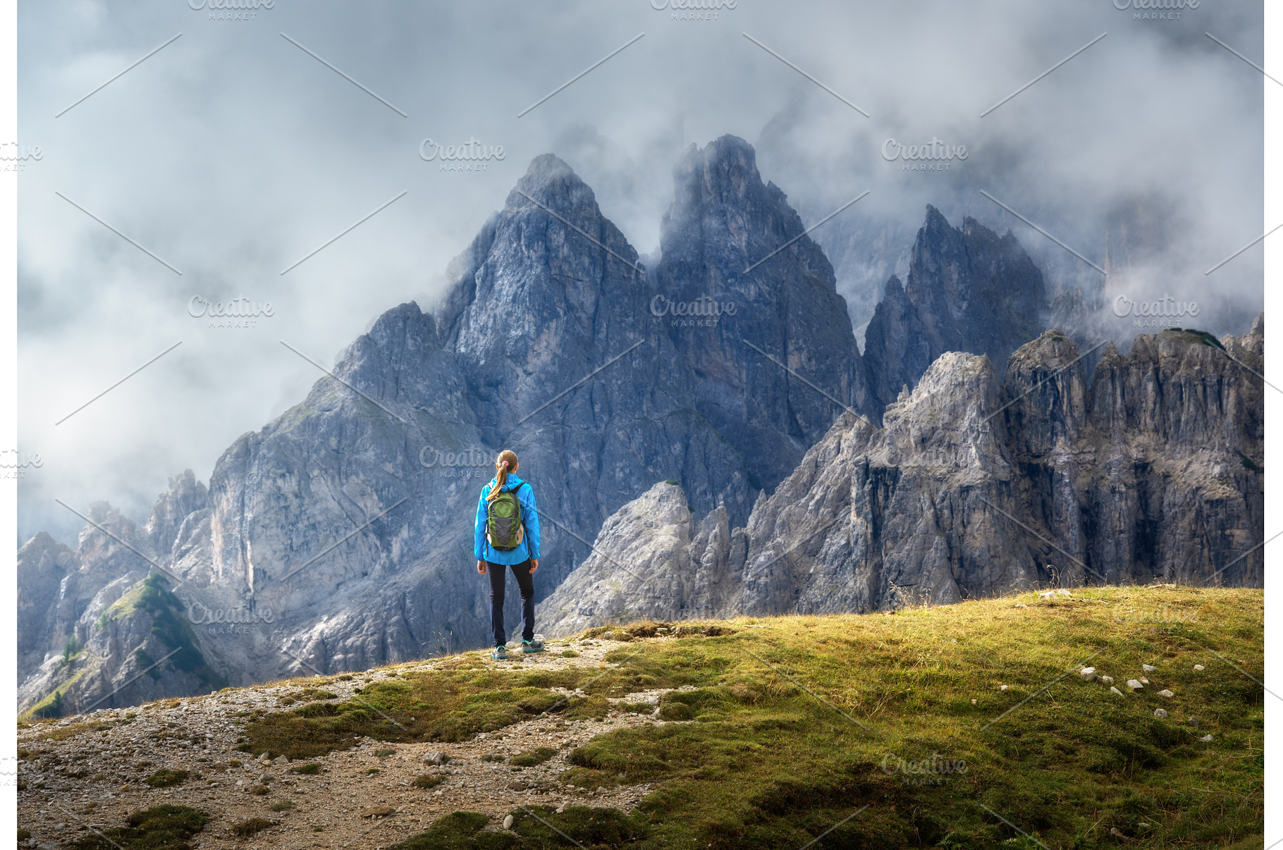 Female hiker admiring Dolomites, a Person Photo by den-belitsky