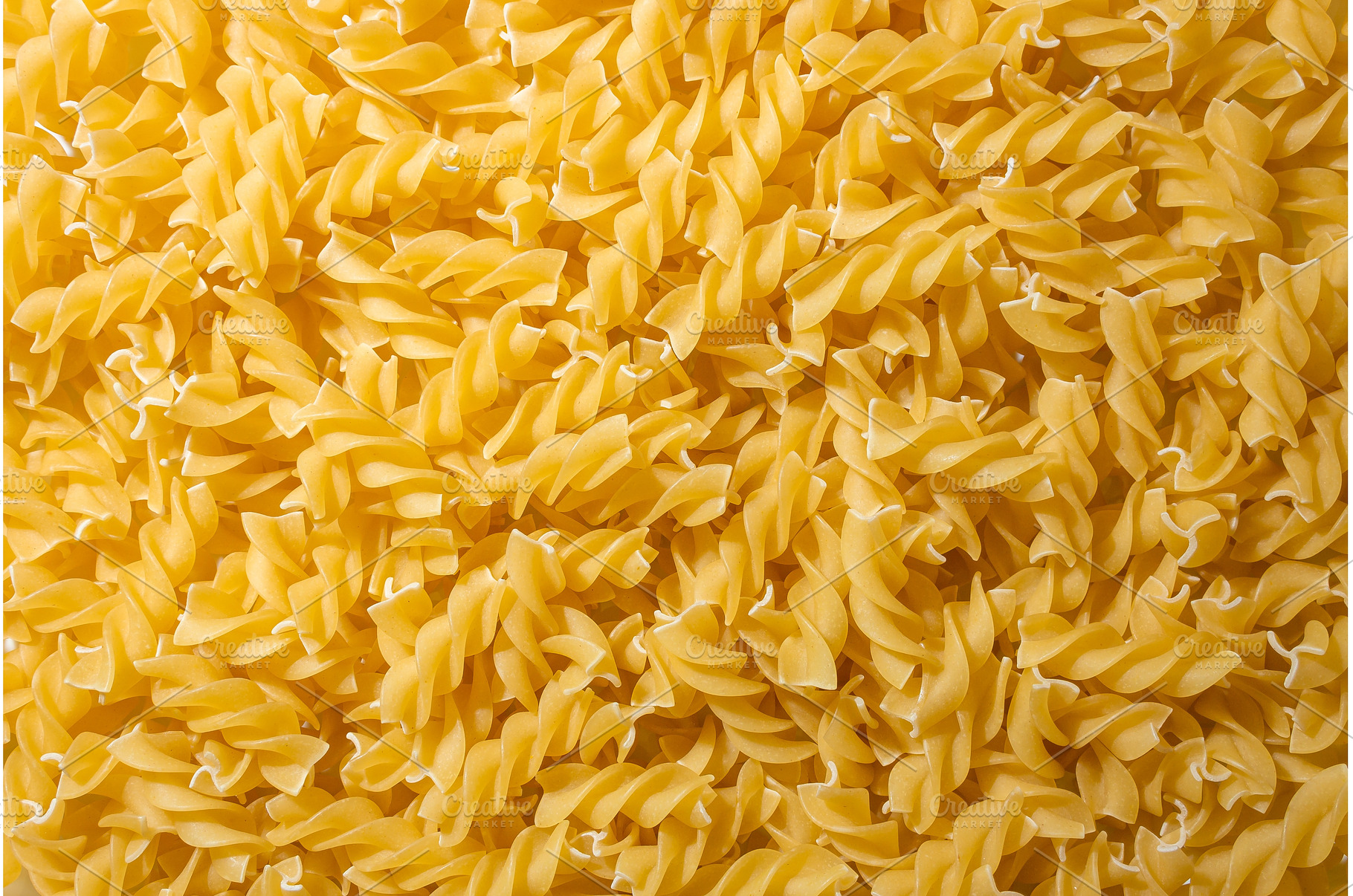 Uncooked Fusilli Pasta Background, a Food & Drink Photo by InfinitumProdux
