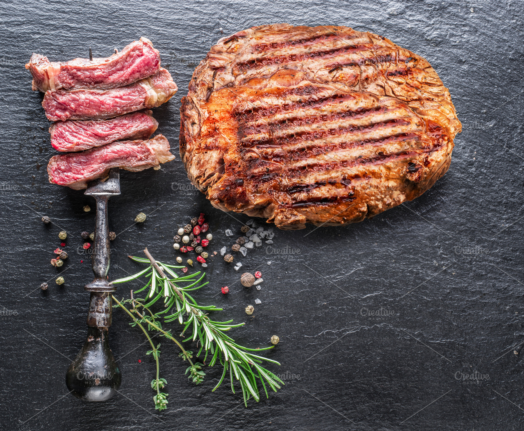 Grilled delicious ribeye steak, a Food & Drink Photo by Volff