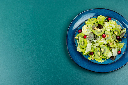 salad of kiwi, leafy greens, a Food & Drink Photo by MLunov MLunov