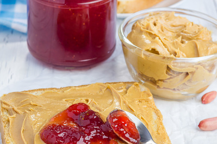 Sandwich with creamy peanut butter and strawberry jam, a Food & Drink Photo by iuliia_n
