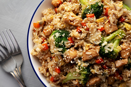 Homemade Chicken Teriyaki Fried Rice on a Plate, top view. Close, a Food & Drink Photo by LiudmylaChuhunova