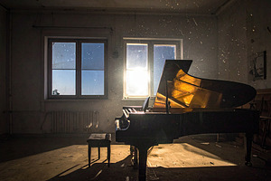 Dark room with grand piano and light, an Architecture Photo by DanFLCreativo