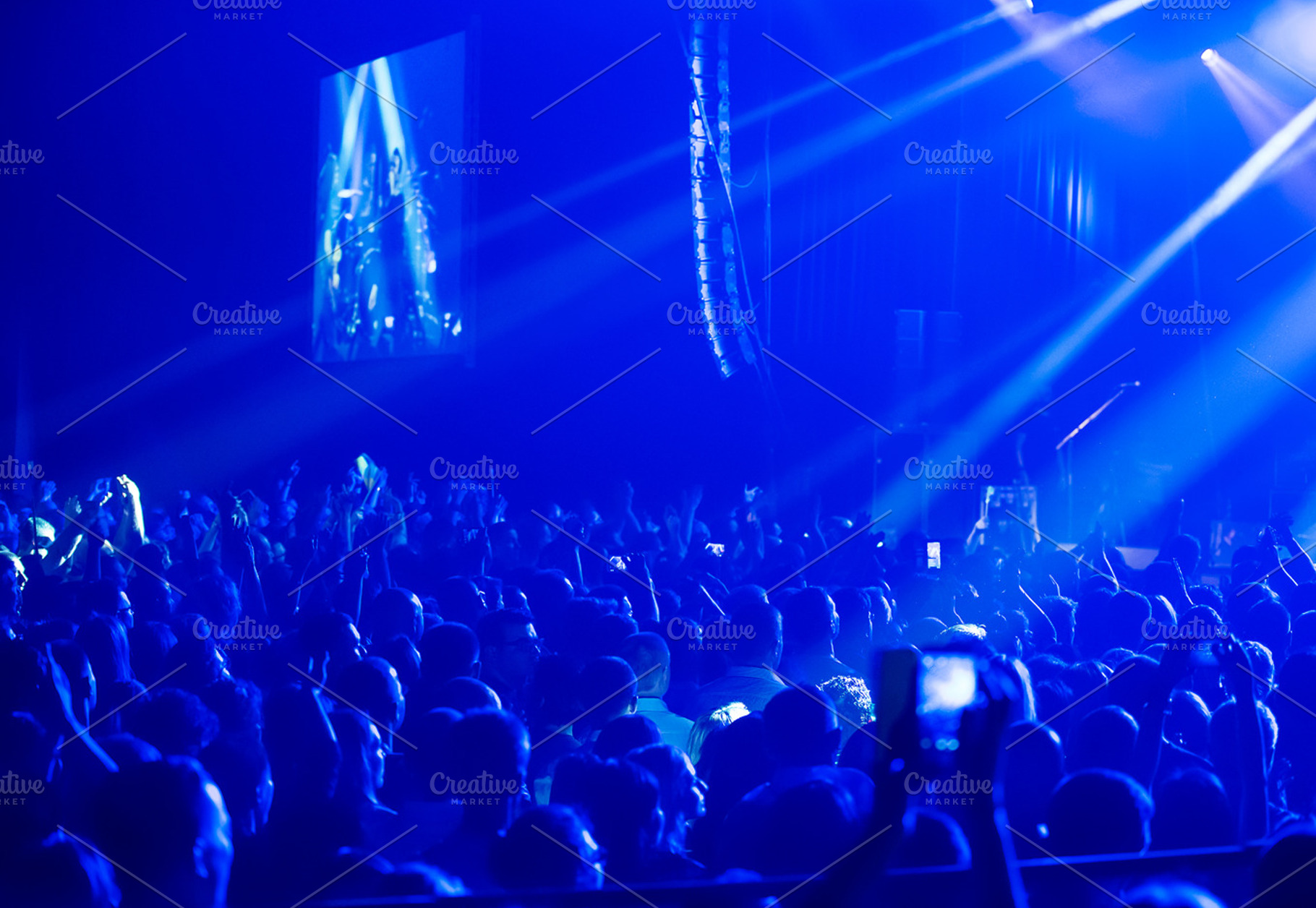 Crowd at concert and blurred stage lights  containing crowd, people, and event, a Person Photo by suprunvitaly