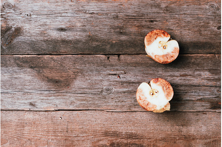 Spoiled bad red apple on wooden, a Food & Drink Photo by Enjoy Photo
