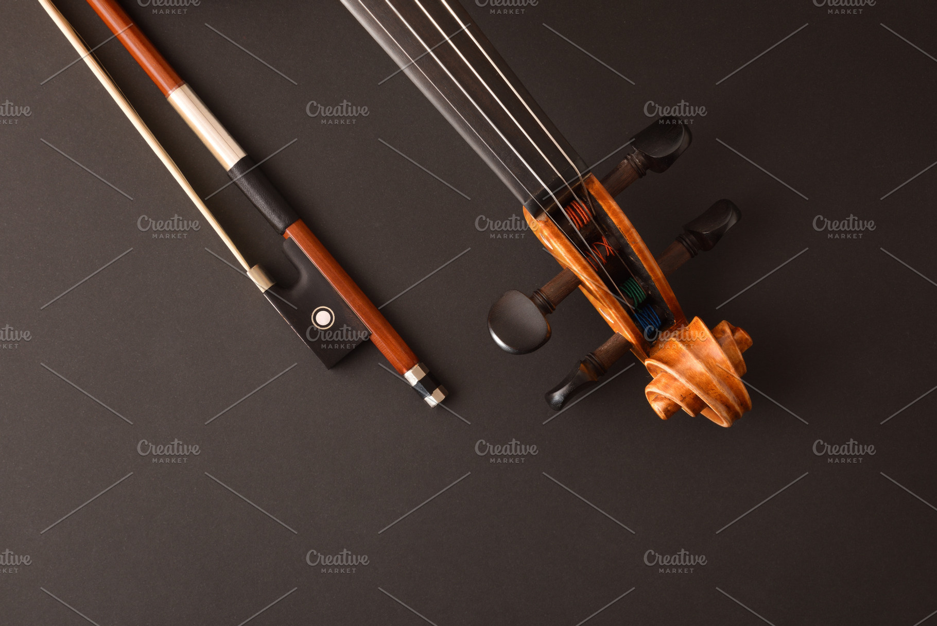 Peg box and neck of violin and bow on black, an Arts & Entertainment Photo by Davizro's Market