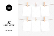 A2 Cards Mockup with clothespins, a Print Template by Dorado Stock (Thumbnail 1 of 4)